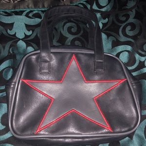 Black purse with grey star outlined in red purse